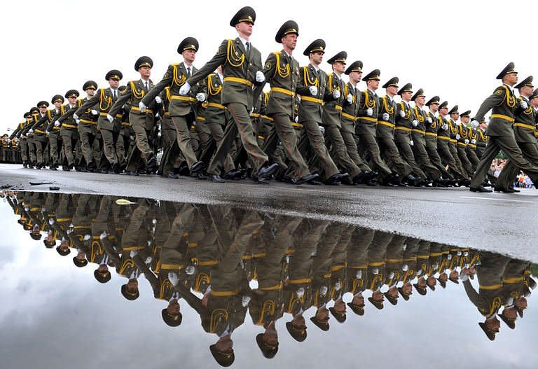 Belarussian soldiers march during an Independence Day parade in Minsk. Belarus security forces on Sunday arrested at least 10 people to prevent a planned opposition protest in front of the Minsk railway station on Independence Day, an AFP correspondent reported