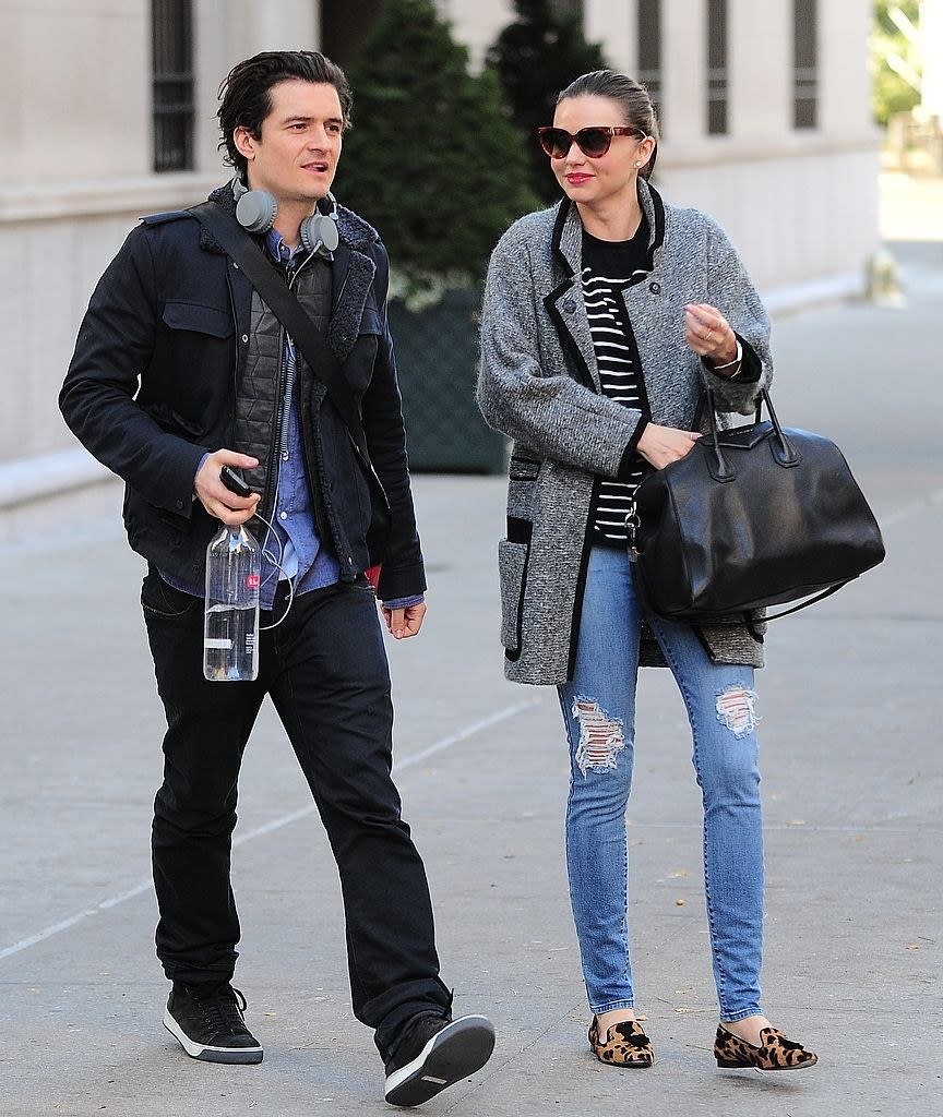 the couple takes a leisurely stroll together through the streets of NYC
