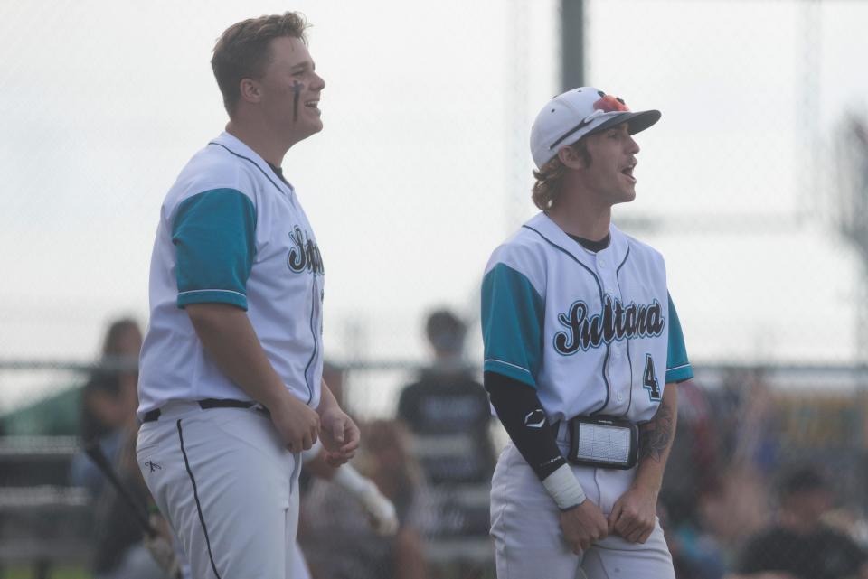 Sultana’s Brayden Booth and Kyle Preston celebrate after RJ Torres drives in a run during the fifth inning on Tuesday, April 11, 2023. Sultana defeated Oak Hills 7-5.