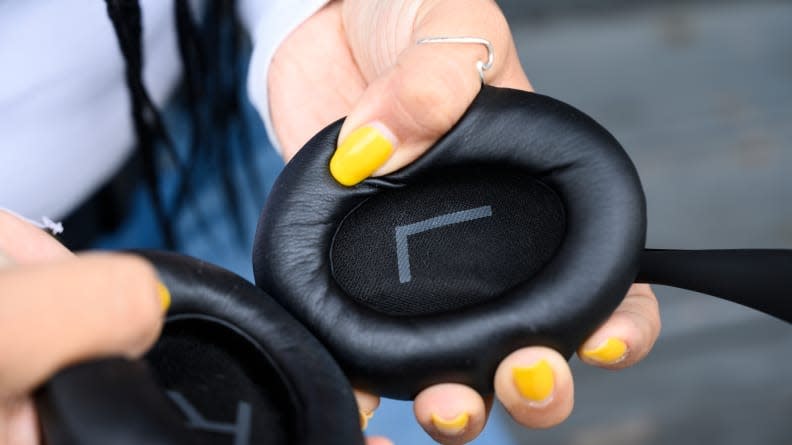 The Bose 700s ear pads are firm but soft, allowing them to fit snugly without feeling too tight. They also have a big L and R printed on them to keep them sorted.