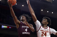 Eastern Kentucky guard Curt Lewis (4) goes to basket while defended by Southern California forward Joshua Morgan (24) during the second half of an NCAA college basketball game Tuesday, Dec. 7, 2021, in Los Angeles. USC won 80-68. (AP Photo/Ringo H.W. Chiu)