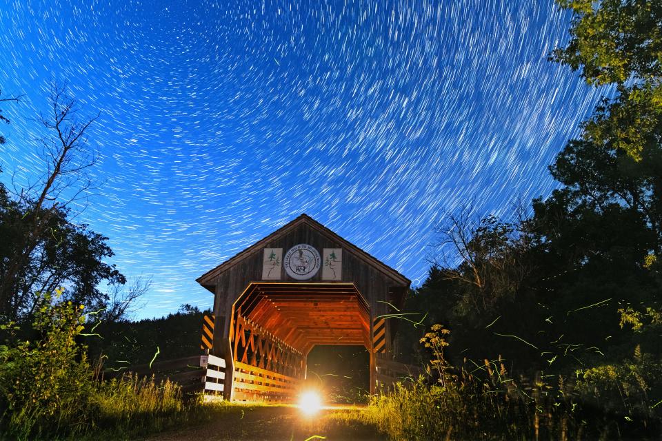 A combination of approximately 50 images taken over the span of about 30 minutes star trails in the night sky and fireflies at Kickapoo Valley Reserve in La Farge on Saturday, June 18, 2022. The park is attempting to be designated as an international dark sky park, only the second of such parks in Wisconsin.