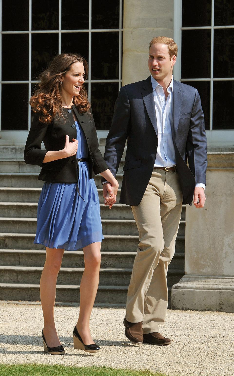 Kate Middleton and Prince William leave for their honeymoon after their wedding in 2011. Middleton wears a blue dress from Zara