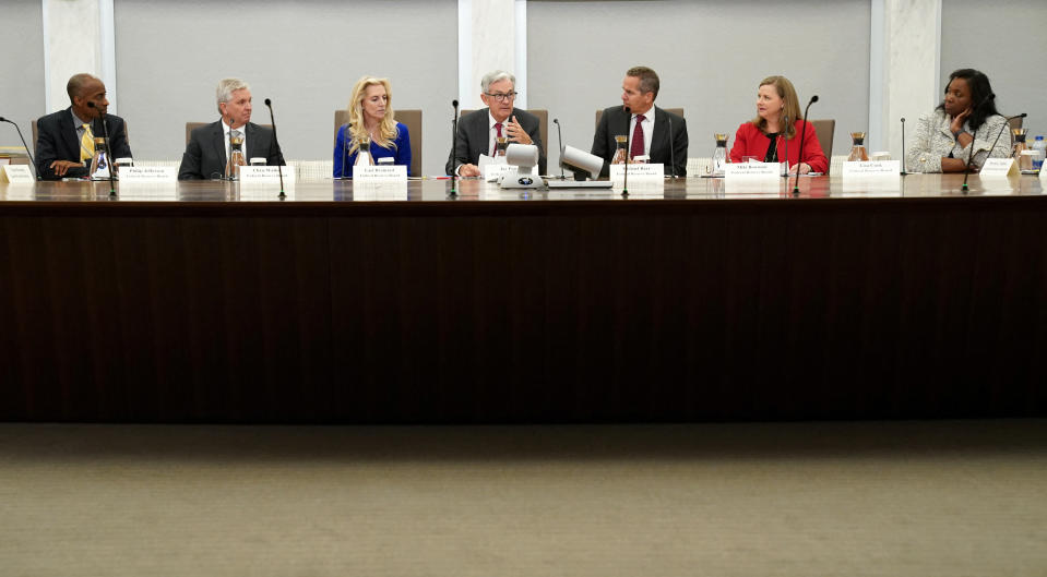 Federal Reserve Board members listen to introductory remarks by Federal Reserve Board Chairman Jerome Powell an event on 