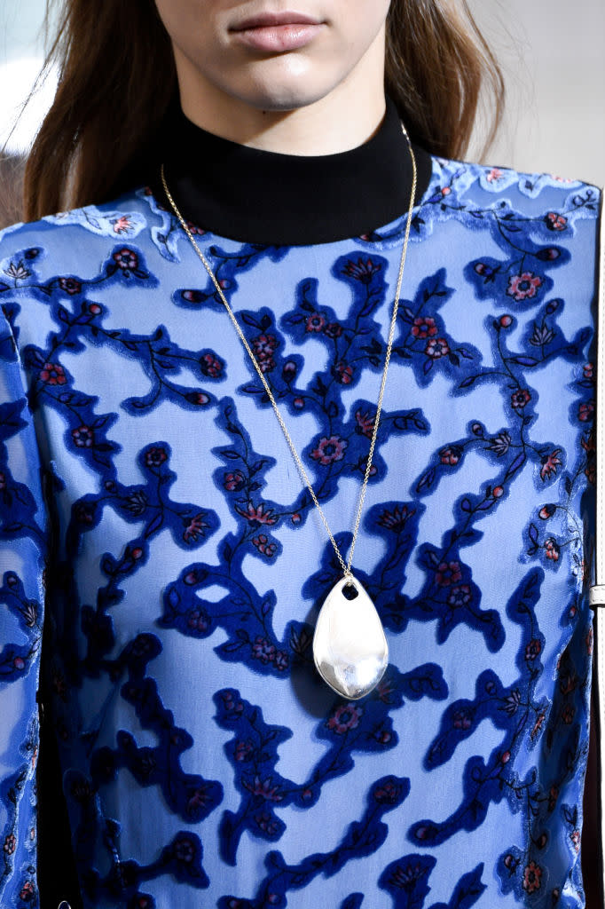 <p>Silver pendant necklace at the Tory Burch FW18 show. (Photo: Getty Images) </p>