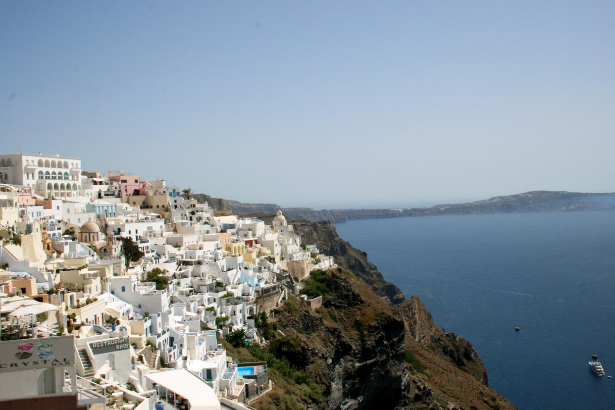 This July 2014 photo shows whitewashed homes stacked like sugar cubes on the seaside cliffs of Santorini, part of Greece’s Cyclades island chain in the Aegean Sea. The Cyclades are known for panoramic waterfront views, black-sand beaches and dramatic sunsets. (AP Photo/Kristi Eaton)