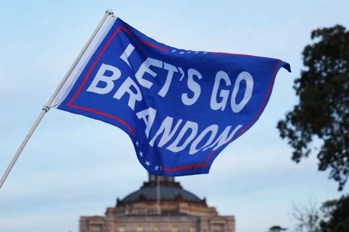<span class="caption">A 'Let's Go Brandon' flag waves near the U.S. Capitol ahead of a House vote on the infrastructure bill.</span> <span class="attribution"><a class="link rapid-noclick-resp" href="https://www.gettyimages.com/detail/news-photo/citizens-from-baltimore-fly-a-lets-go-brandon-flag-on-the-news-photo/1236480723?adppopup=true" rel="nofollow noopener" target="_blank" data-ylk="slk:Tom Williams/CQ-Roll Call, Inc via Getty Images">Tom Williams/CQ-Roll Call, Inc via Getty Images</a></span>