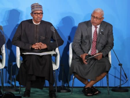 Fiji Prime Minister Bainimarama speaks next to Nigeria's President Buhari during the 2019 United Nations Climate Action Summit at U.N. headquarters in New York City, New York, U.S.