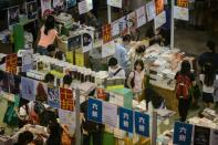 Customers browse books at the annual book fair in Hong Kong on July 20, 2016