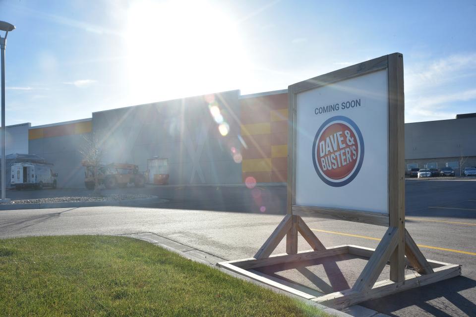 A sign outside of the construction site for Dave & Buster's reads "coming soon" on Nov. 19, 2021.