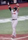 Boston Red Sox's Michael Chavis celebrates after hitting a two-run home run off Tampa Bay Rays starter Ryan Yarbrough during the sixth inning of a baseball game Wednesday, Aug. 5, 2020, in St. Petersburg, Fla. (AP Photo/Steve Nesius)