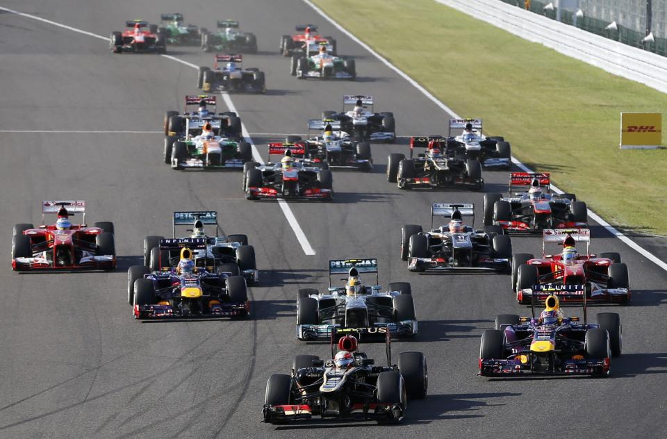 Lotus Formula One driver Romain Grosjean of France leads during the Japanese F1 Grand Prix at the Suzuka circuit October 13, 2013. REUTERS/Issei Kato (JAPAN - Tags: SPORT MOTORSPORT F1)