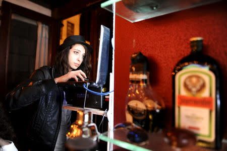 Marah, a DJ at 80s Bar, plays music in Damascus, Syria March 13, 2016. REUTERS/Omar Sanadiki