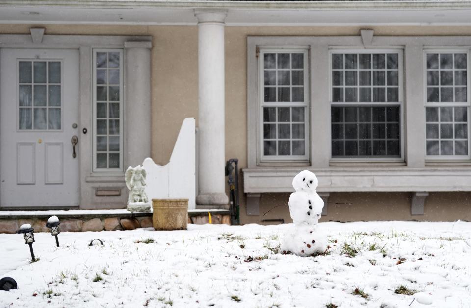 Snow is shown on a Summit Avenue front yard, in Hackensack, Sunday, January 7, 2024.