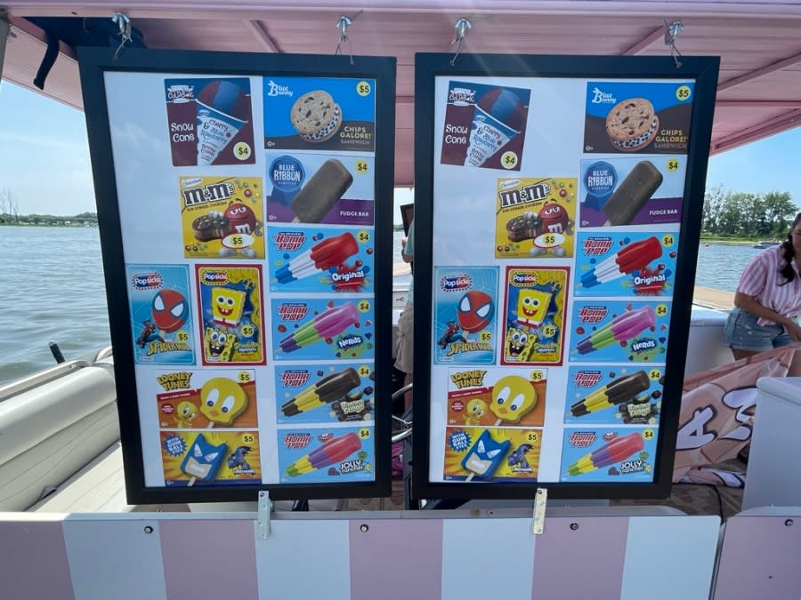 The Ice Cream Afloat menu hangs off the side of the pontoon boat.