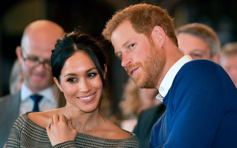 Prince Harry and Meghan Markle watch a dance performance by Jukebox Collective at Cardiff Castle - PA Pool