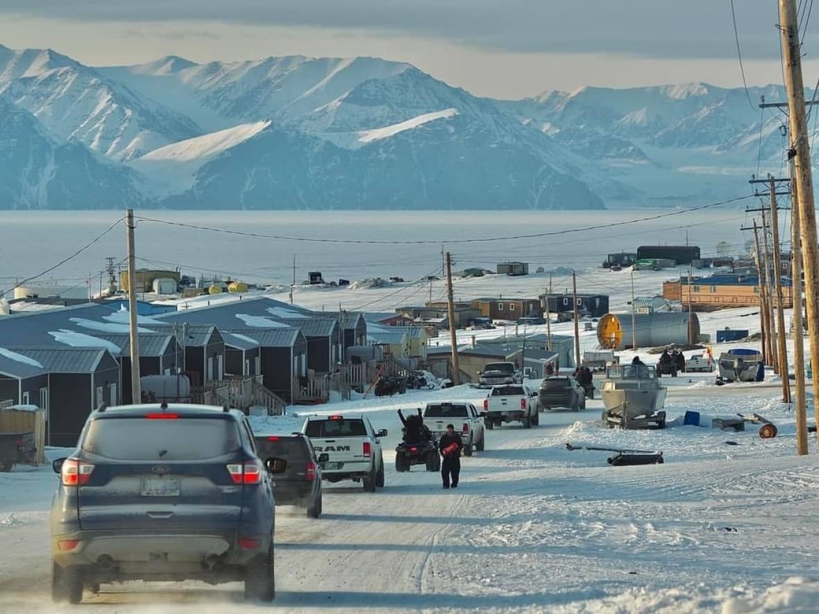 People in Pond Inlet, Nunavut, celebrate with a parade on Friday after the Nunavut Impact Review Board (NIRB) issued its long-awaited recommendation on a proposed expansion of Baffinland's Mary River mine project. The NIRB recommended against the expansion, with a final decision yet to be made by the federal government. (Submitted by Andrew Tagak - image credit)