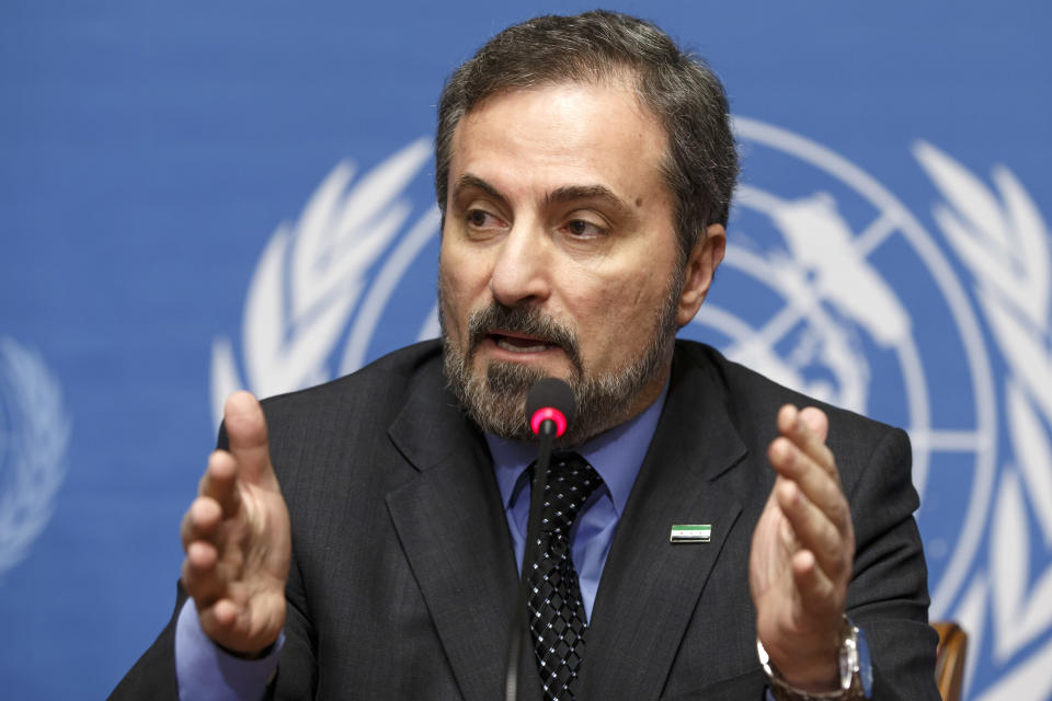 Louay Safi, spokesperson for the Syrian National Coalition, speaks to the media during a news conference after the second round of negotiations between the Syrian government and the opposition at the European headquarters of the United Nations, in Geneva, Switzerland, Friday, Feb. 14, 2014. (AP Photo/Keystone, Salvatore Di Nolfi)