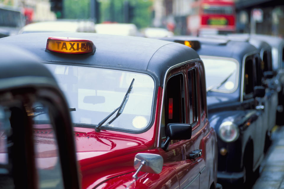 Taxi cabs lined up.