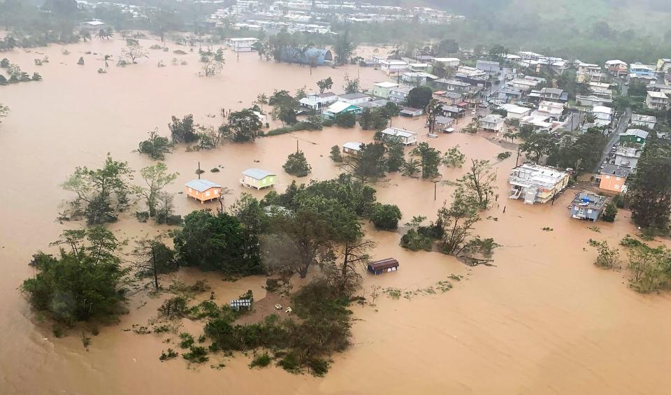 Puerto Rico: In an aerial photo, floodwaters surround houses