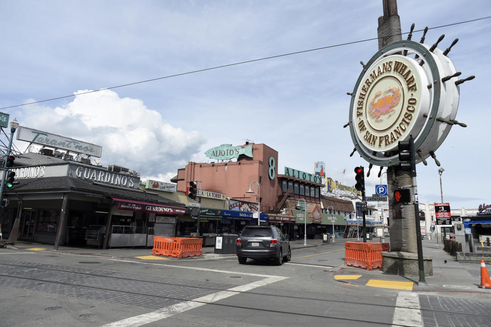 Fisherman's Wharf in San Francisco, normally crowded with tourists and locals, was virtually deserted on as millions of people in several Bay Area counties were under orders to stay in their homes starting March 17, 2020, to combat spread of the coronavirus. | Neal Waters—Anadolu Agency/Getty Images