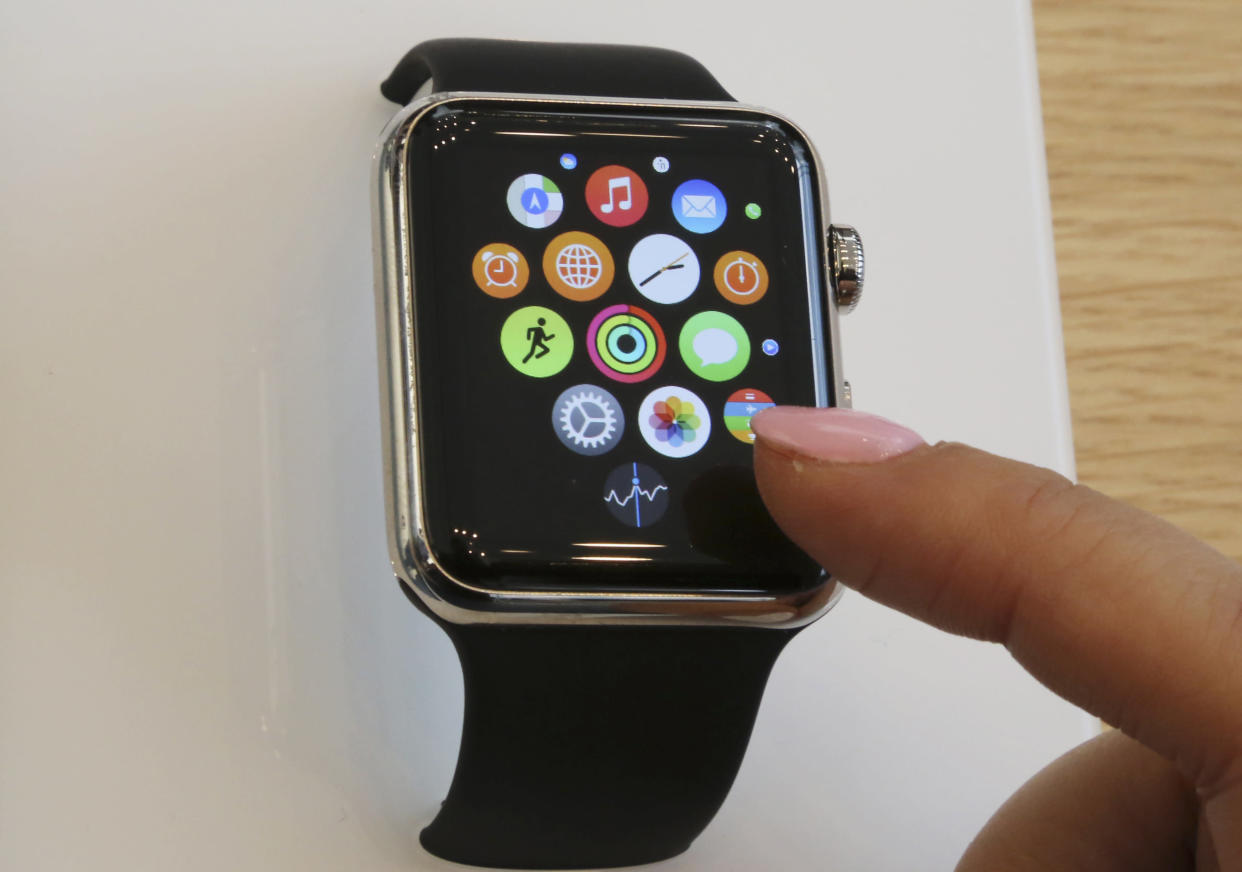 FILE - In this April 10, 2015, file photo, a customer demonstrates the Apple Watch at an Apple Store in Tokyo. It might be tempting to get a fitness tracker, now that the weather’s nice and you’re spending more time outdoors. Indeed, many people will find one useful, whether it’s a fitness-specific tracker like a Fitbit or Samsung’s new Gear Fit2, or a multi-purpose smartwatch like Apple Watch. But if you’re already athletic or fairly stable in your routine, they might just tell you the same thing over and over again. Although, one of the devices might help if you’re new to exercise or looking to increase your physical activity. Before spending as much as a few hundred dollars on a fitness tracker, see if your expectations align with its capabilities. (AP Photo/Koji Sasahara, File)