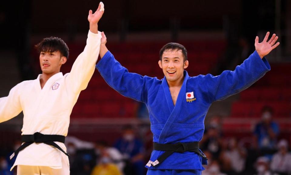 Naohisa Takato celebrates his win against Taiwan’s Yang Yung in the men’s 60kg judo final