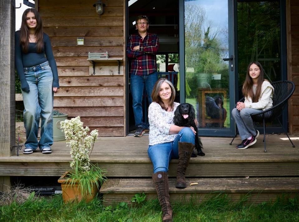 Jacques pictured at her home with her two children, husband and dog