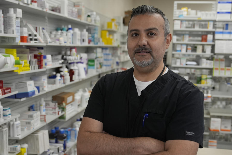 George Tadross, part-owner and pharmacy manager at MAC Pharmacy, stands for a portrait, Wednesday, May 29, 2024, in Cleveland. “You have to have a pharmacist to talk to,” Tadross says. “My philosophy in the pharmacy business is you know your doctor, he knows everything about you. You need to know your pharmacist as well (because) the pharmacist is the only one that sees the whole medical treatment plan you have.” (AP Photo/Sue Ogrocki)