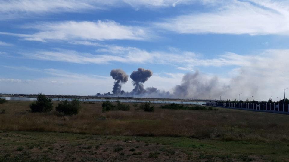 Smoke rises after explosions were heard from the direction of a Russian military airbase near Novofedorivka, Crimea, in this still image obtained by Reuters August 9, 2022.