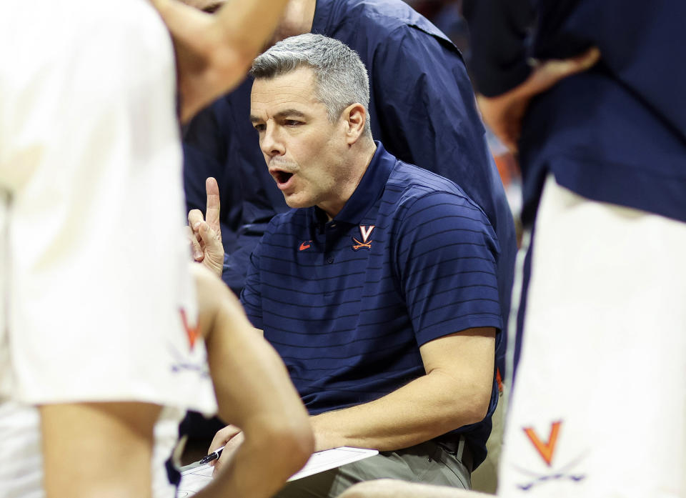 Virginia head coach Tony Bennett talks with players in the huddle during an NCAA college basketball game against Pittsburgh in Charlottesville, Va., Friday, Dec. 3, 2021. (AP Photo/Andrew Shurtleff)