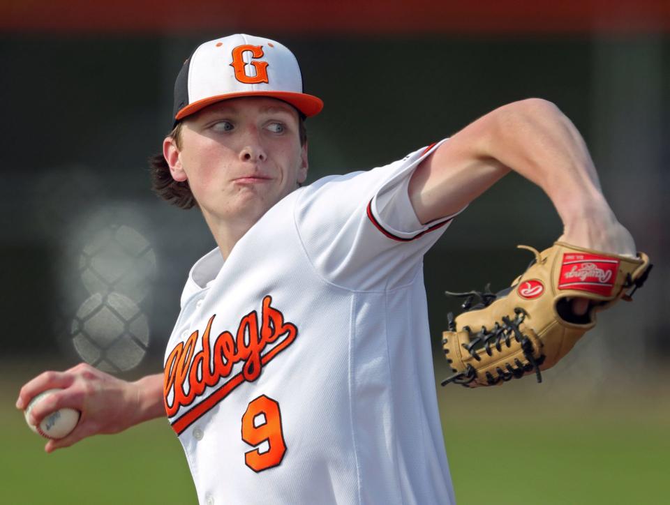 Green pitcher Jacob Rollyson winds up for an Ellet batter during the first inning of a Division I sectional semifinal, Tuesday, May 18, 2021.