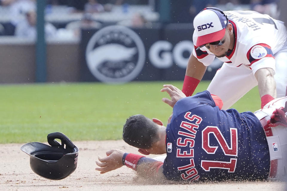 Chicago White Sox second baseman Cesar Hernandez, right, tags out Boston Red Sox's Jose Iglesias (12) at second base during the sixth inning of a baseball game, Sunday, Sept. 12, 2021, in Chicago. (AP Photo/David Banks)
