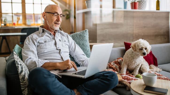 A man speaks with financial advisor during a virtual meeting. 