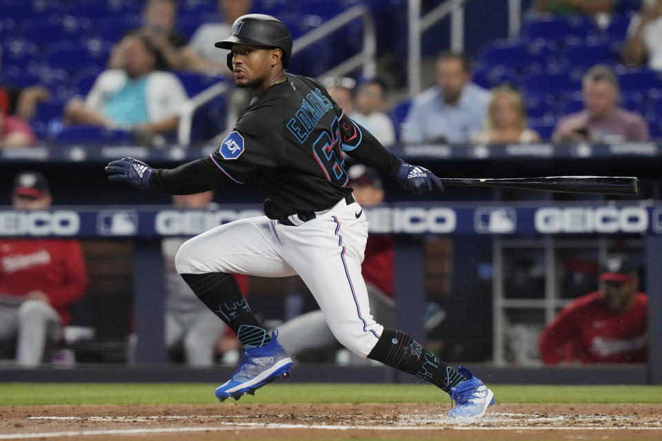 Miami Marlins Xavier Edwards hits a double to left field during the third inning of a baseball game against the Washington Nationals, Thursday, May 18, 2023, in Miami. (AP Photo/Marta Lavandier)