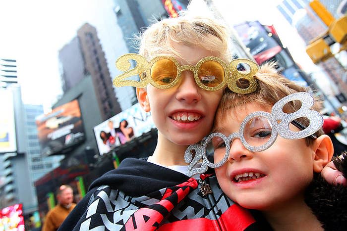 Kids celebrating in Times Square with "2008" eyeglasses