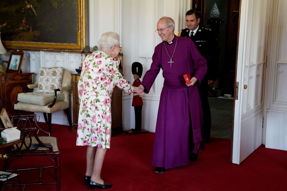 Britain's Queen Elizabeth II receives Archbishop of Canterbury Justin Welby at Windsor Castle on June 21, when he presented her with a special "Canterbury Cross" for her service to the Church of England over 70 years and a citation for the Cross, which was presented as a framed piece of calligraphy. (Photo by ANDREW MATTHEWS/POOL/AFP via Getty Images)