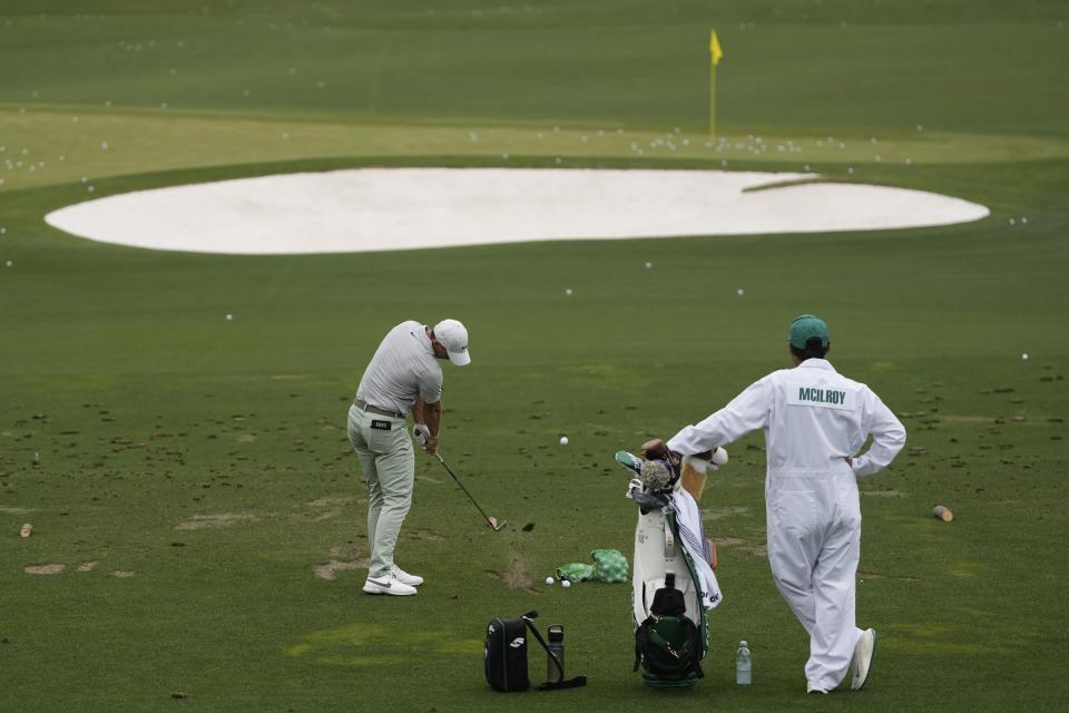 Rory McIlroy, of Northern Ireland, hits on the driving range during a practice round in preparation for the Masters golf tournament at Augusta National Golf Club Tuesday, April 9, 2024, in Augusta, Ga. (AP Photo/Charlie Riedel)