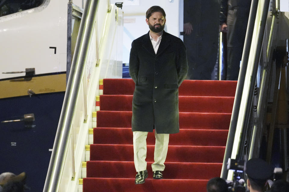 Chilean President Gabriel Boric arrives at Beijing's airport ahead of the Belt and Road Forum in the Chinese capital on Sunday, Oct. 15, 2023. (Ken Ishii/Pool Photo via AP)