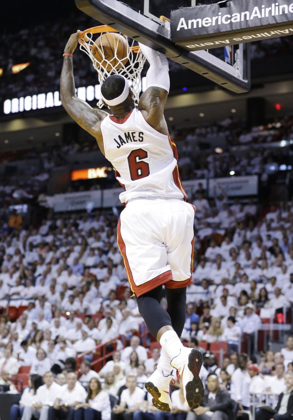 Miami Heat forward LeBron James dunks the ball during the first half of Game 2 of an Eastern Conference semifinal basketball game against the Brooklyn Nets, Thursday, May 8, 2014 in Miami. (AP Photo/Wilfredo Lee)