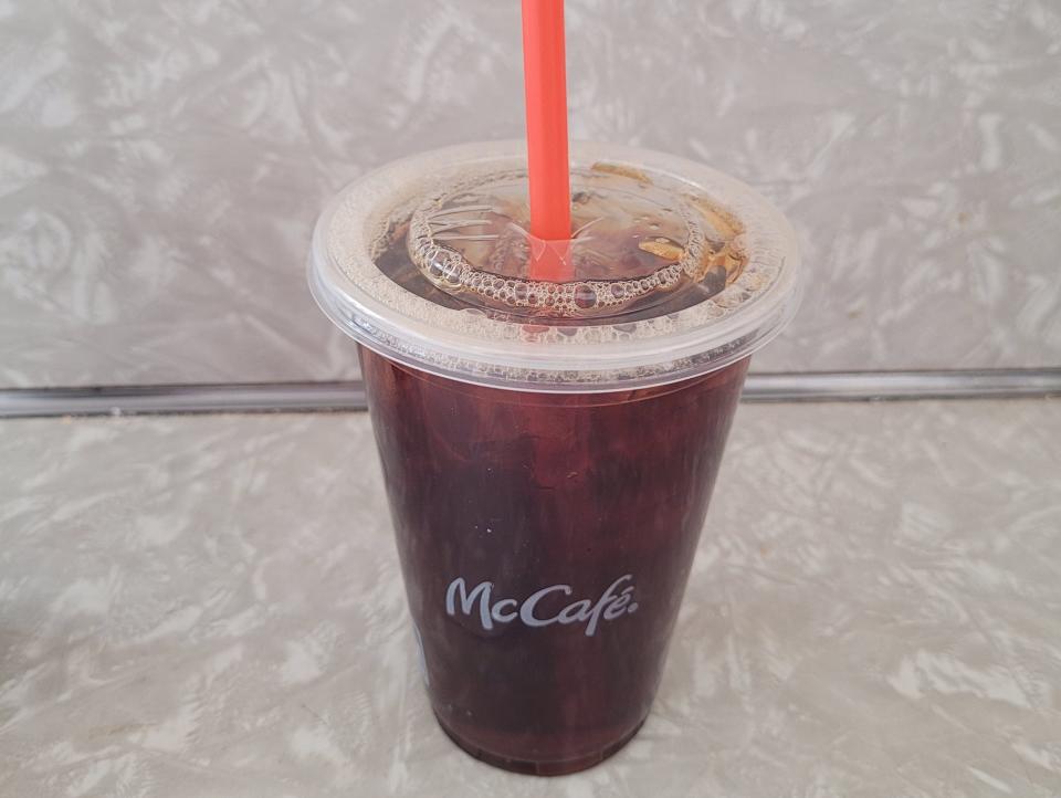 cup of black iced coffee from mcdonald's