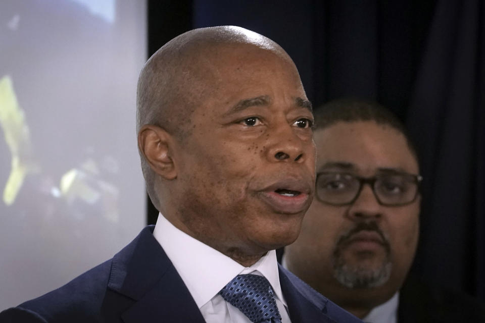 New York Mayor Eric Adams speaks during a press conference about several charges for migrants involved in a Times Square brawl with police, Thursday, Feb. 8, 2024, in New York. Looking on is Mnahattan District Attorney Alvin Bragg. (AP Photo/Bebeto Matthews)