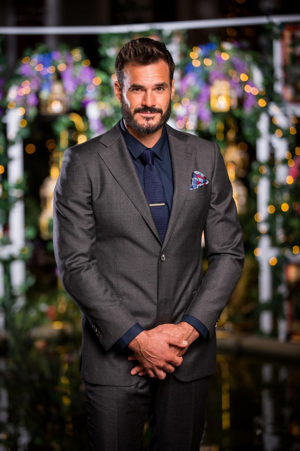 Locky Gilbert wearing a suit on set of The Bachelor Australia 2020