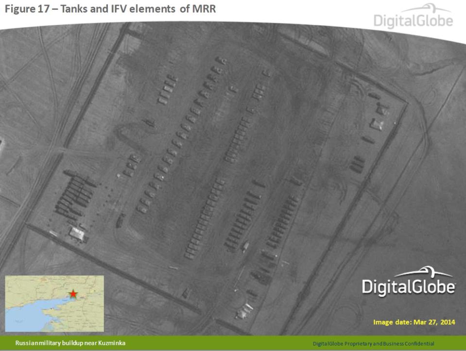 This satellite image made by DigitalGlobe on March 27, 2014, and provided by Supreme Headquarters Allied Powers Europe (SHAPE) on Tuesday, April 9, 2014, shows what are purported to be Russian military tanks and infantry fighting vehicles at a military base near Kuzminka, east of the Sea of Azov in southern Russia. The image is one of several provided to the AP by NATO’s headquarters that show dozens of Russian tanks and other armored vehicles, combat jets and helicopter gunships stationed inside Russian territory near to the eastern border with Ukraine. AP cannot independently verify the authenticity or content of this image. (AP Photo/DigitalGlobe via SHAPE) MANDATORY CREDIT, NO CROPPING OR MODIFICATIONS ALLOWED