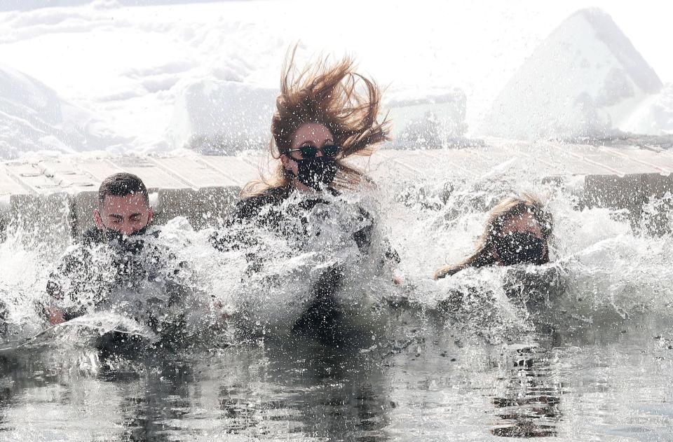 Participants in the 23rd annual  Fishkill Polar Plunge jump into the chilly waters of Sharp Reservoir at Camp Mariah in Fishkill Feb. 20, 2021. The Fishkill Polar Plunge raises funds for Special Olympics New York athletes in the Hudson Valley Region.