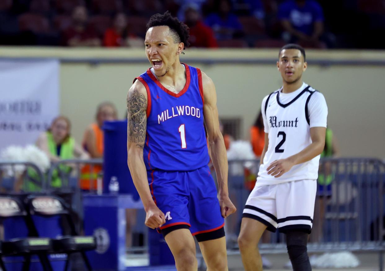 Millwood's Xon Williams celebrates a 3-point basket in front of Mount St. Mary's Eli Jones during the Class 3A boys state basketball game between Millwood and Mount St. Mary at State Fair Arena in Oklahoma City, Tuesday, March 5, 2024.