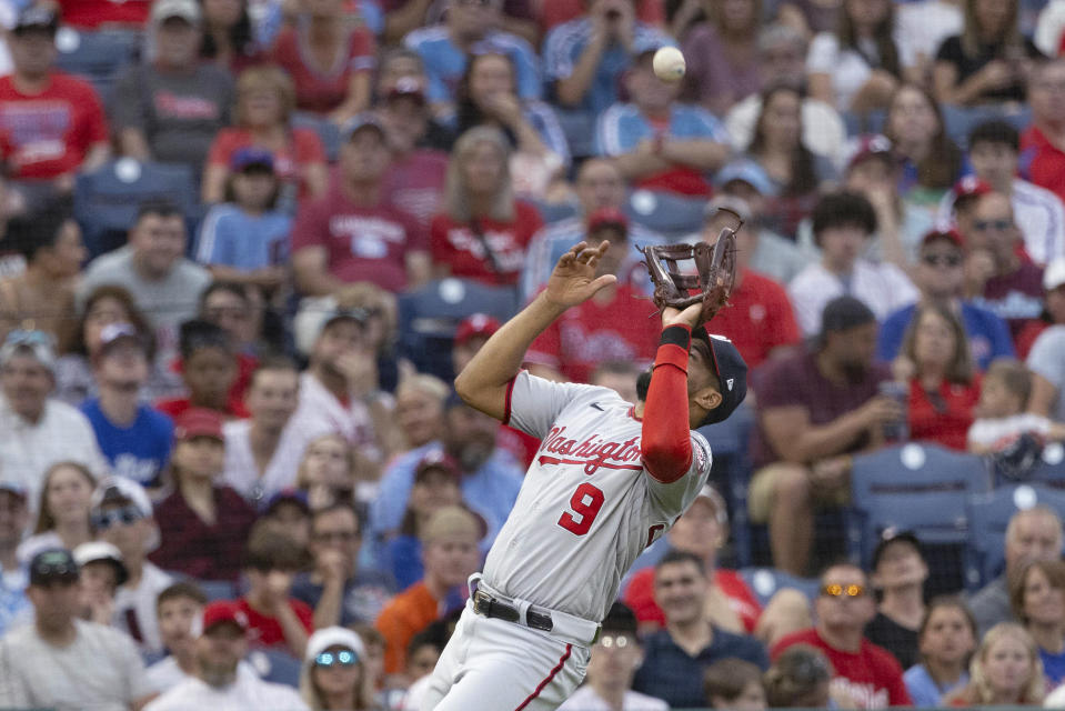 Washington Nationals third baseman Jeimer Candelario catches a popup from Philadelphia Phillies' Bryce Harper during the sixth inning of a baseball game Friday, June 30, 2023, in Philadelphia. (AP Photo/Laurence Kesterson)