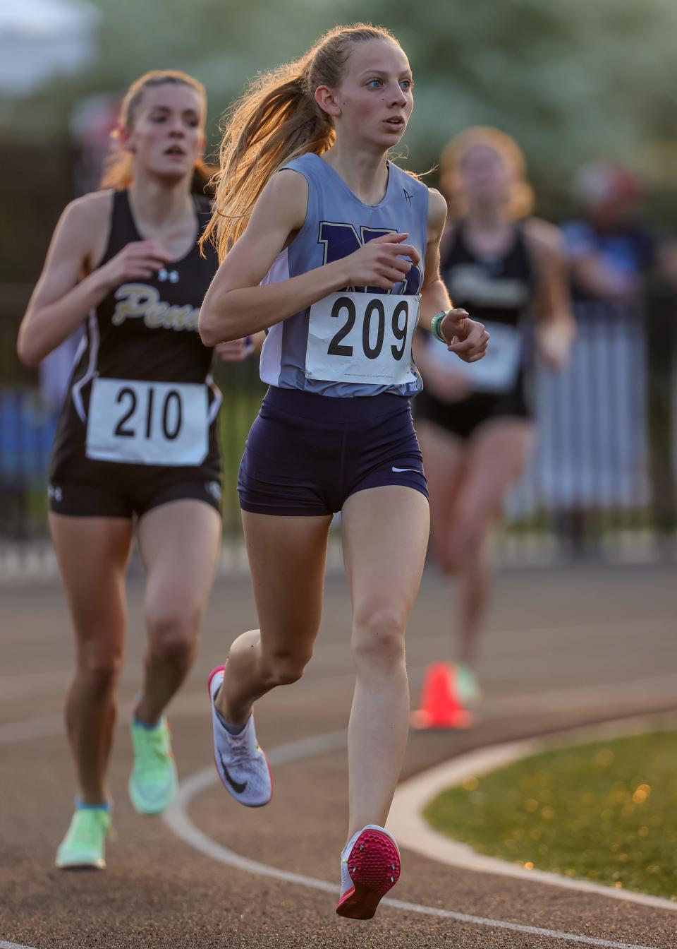 Lillian Zelasko of New Prairie leads the way in the 3200 meter race during the NIC girls track meet Tuesday, May 10, 2022 at Elkhart High School. Zelasko finished second in the 1,600 at the Portage Regional to qualify for state finalls.