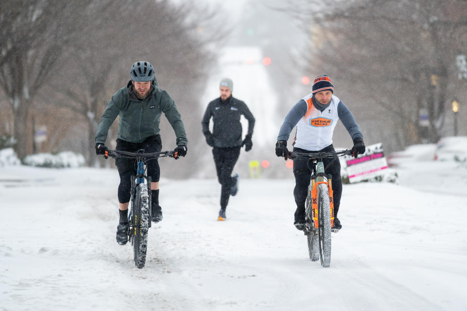 People ride bicycles