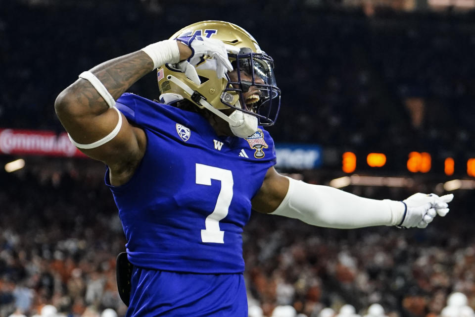 Washington cornerback Jabbar Muhammad (1) celebrates a recovered fumble against Texas during the second half of the Sugar Bowl CFP NCAA semifinal college football game, Monday, Jan. 1, 2024, in New Orleans. (AP Photo/Jacob Kupferman)